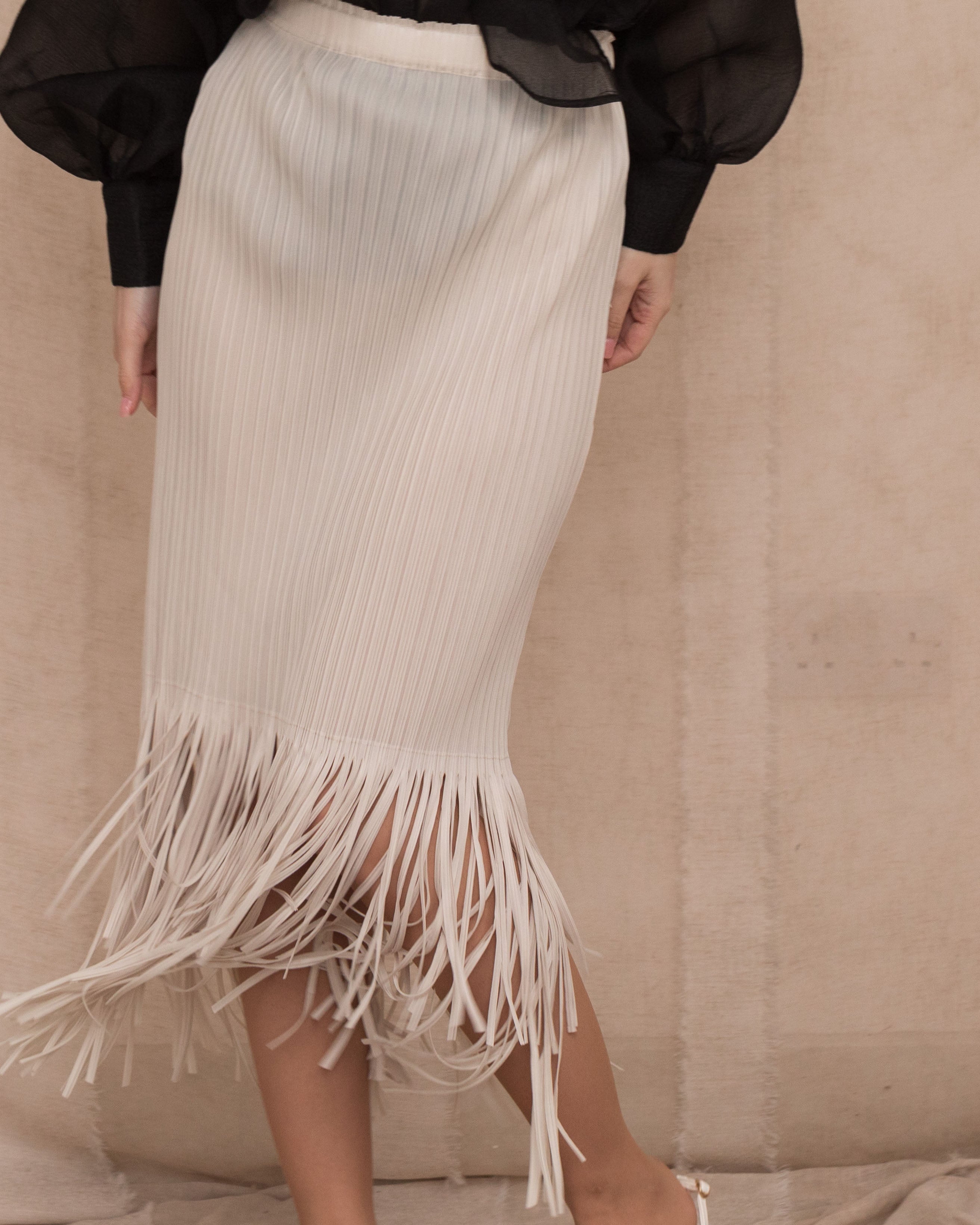 Olivia Row™ | Pleated Midi Skirt with multi fringed tassel hem design in White