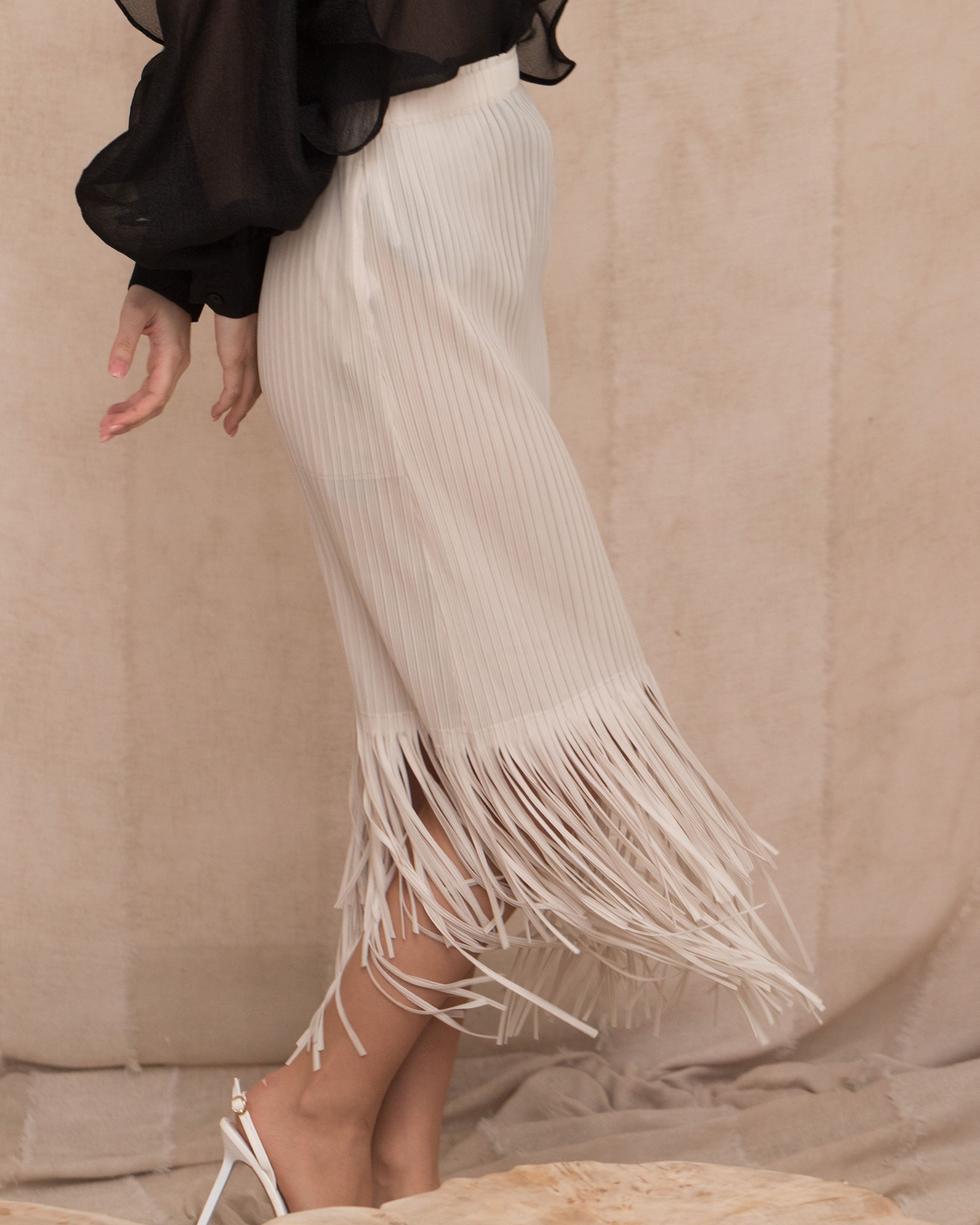 Olivia Row™ | Pleated Midi Skirt with multi fringed tassel hem design in White