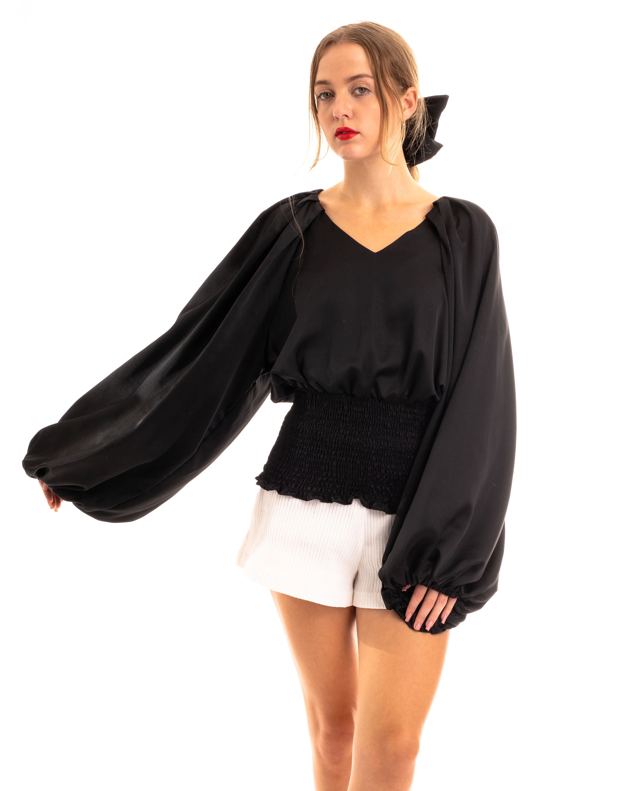 Olivia Row™ | Puff sleeve smocked top in black