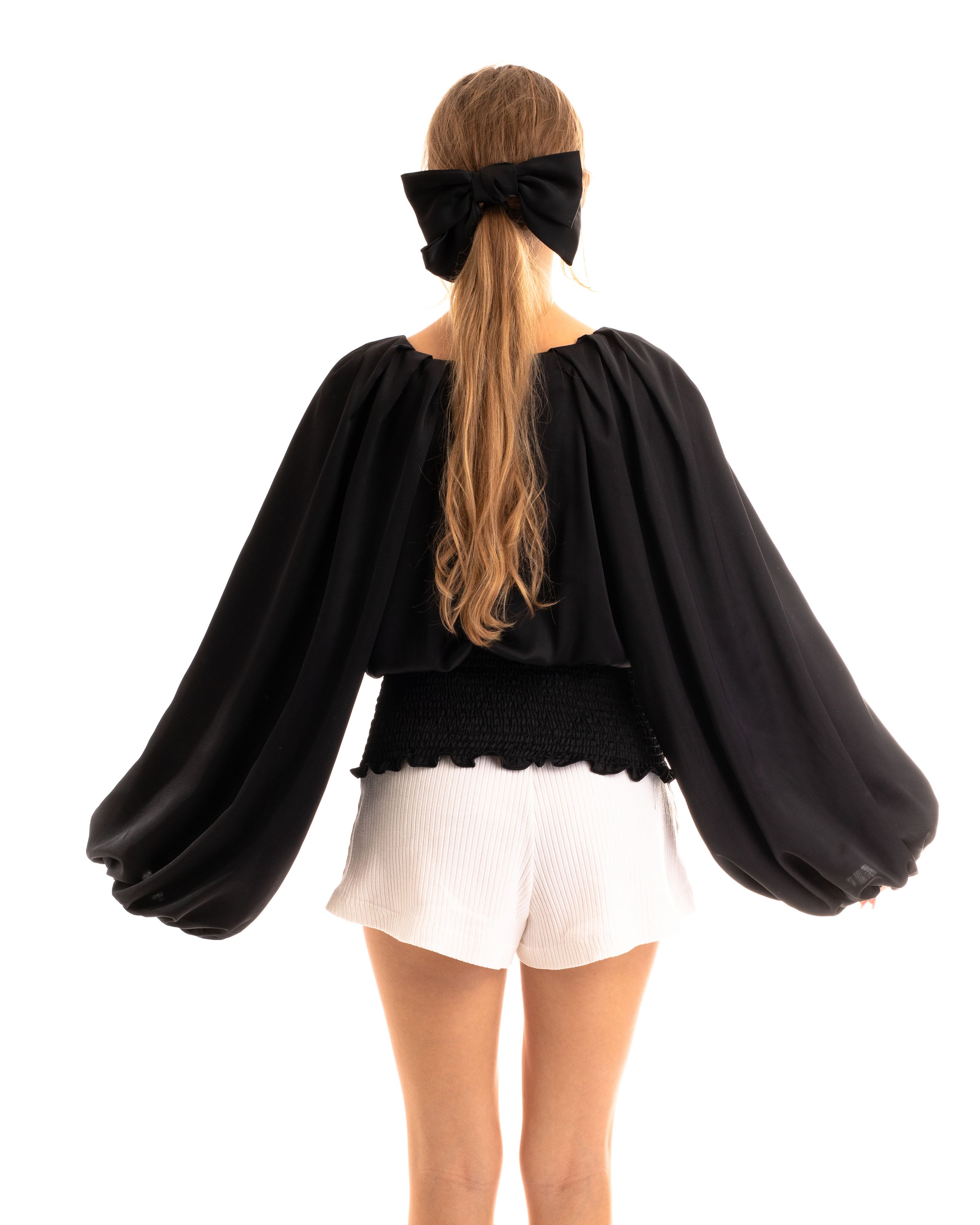 Olivia Row™ | Puff sleeve smocked top in black